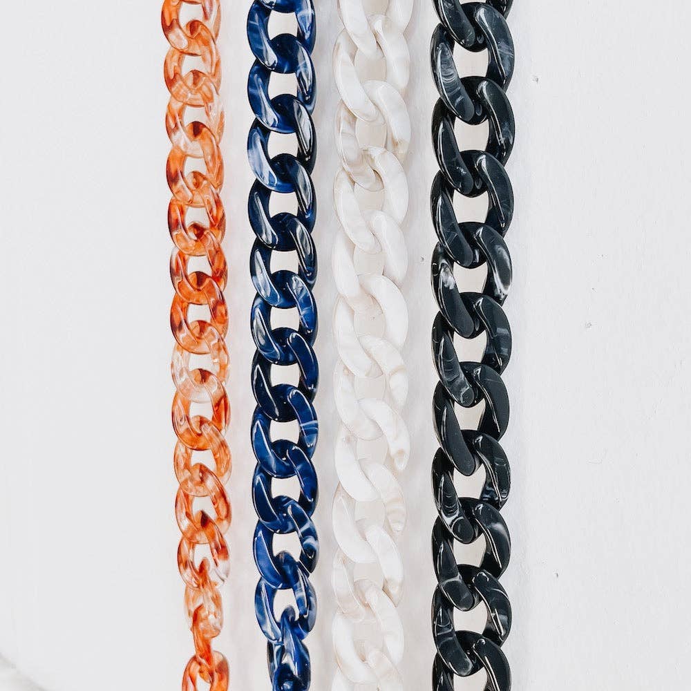 Pretty SImple | Acrylic Chain Strap | 4 straps shown, orange, navy, white, and black.