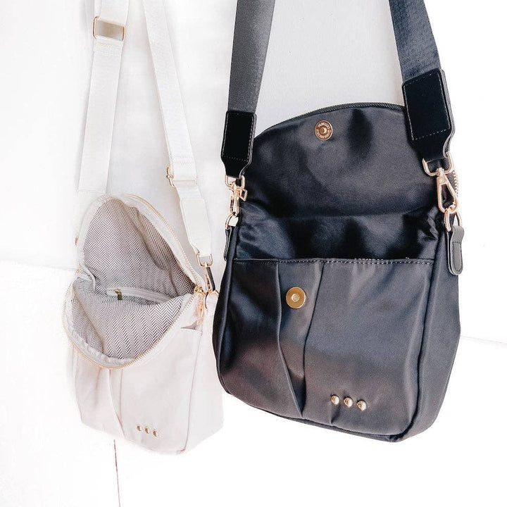 Pretty Simple | Tilly Crossbody Bag | Black and white, both with gold hardware. Detail shot of the interior.