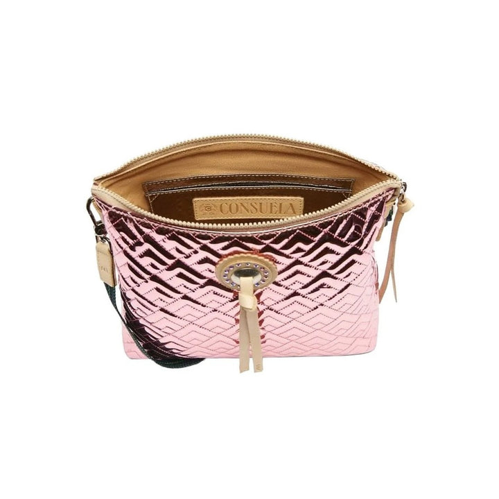 Quinn Downtown Crossbody | Consuela | Interior shot of the shimmering pink bag. The interior is brown leather with an interior side pocket.