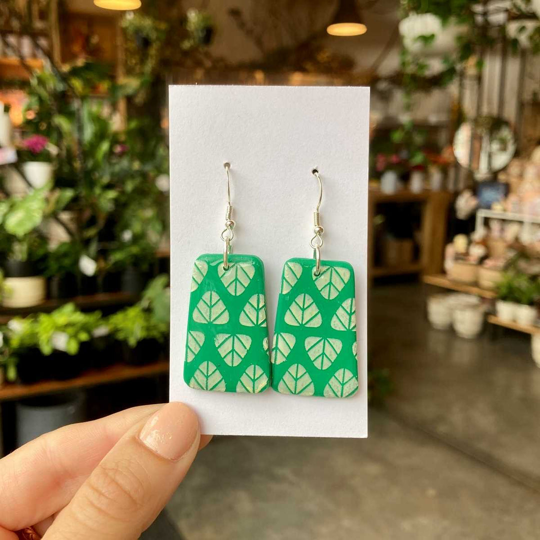 Rivergirl Curiosities | Green Leaf Polymer Clay Earrings | Handmade green polymer clay earrings with a light green pattern.