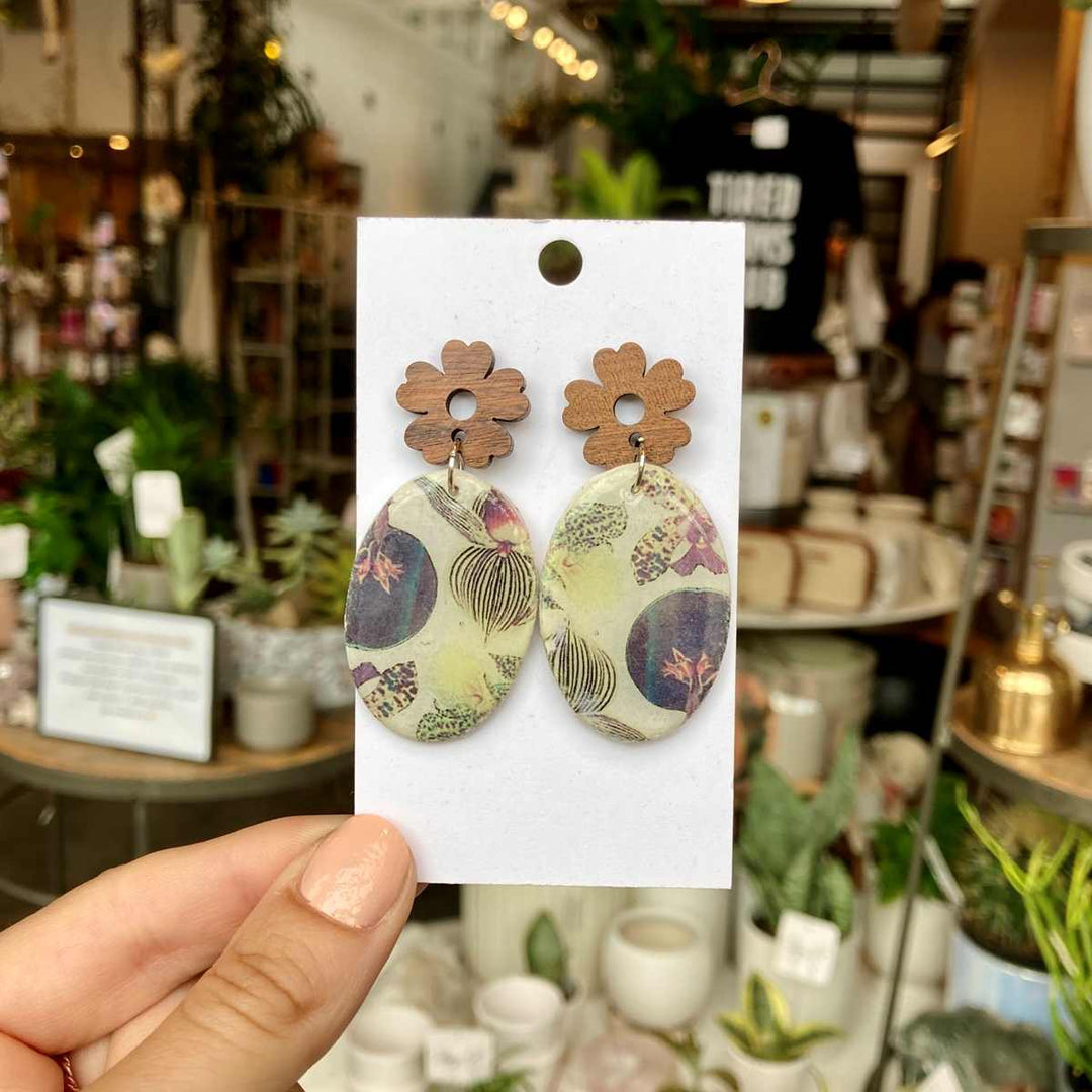 Rivergirl Curiosities | Orchid Earrings | Oval floral earrings with an orchid design and a wooden flower stud.