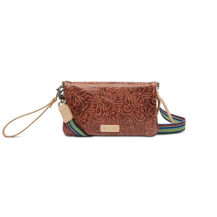 Sally Uptown Crossbody | Consuela | A brown leather bag with darker floral pattern, multicolor crossbody strap and diego leather accents.
