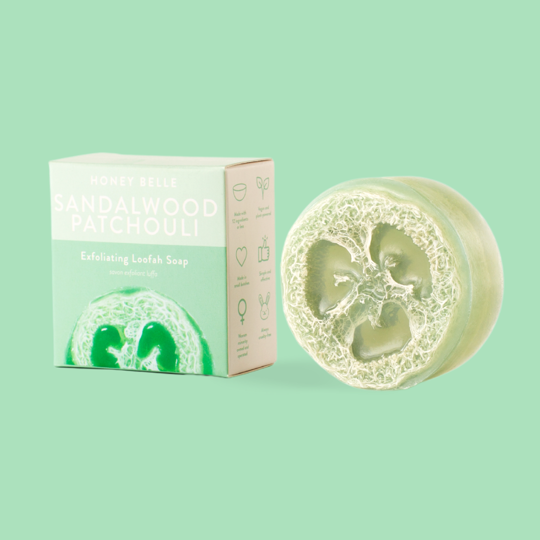 Sandalwood Patchouli soap bar and packaging on a light green background