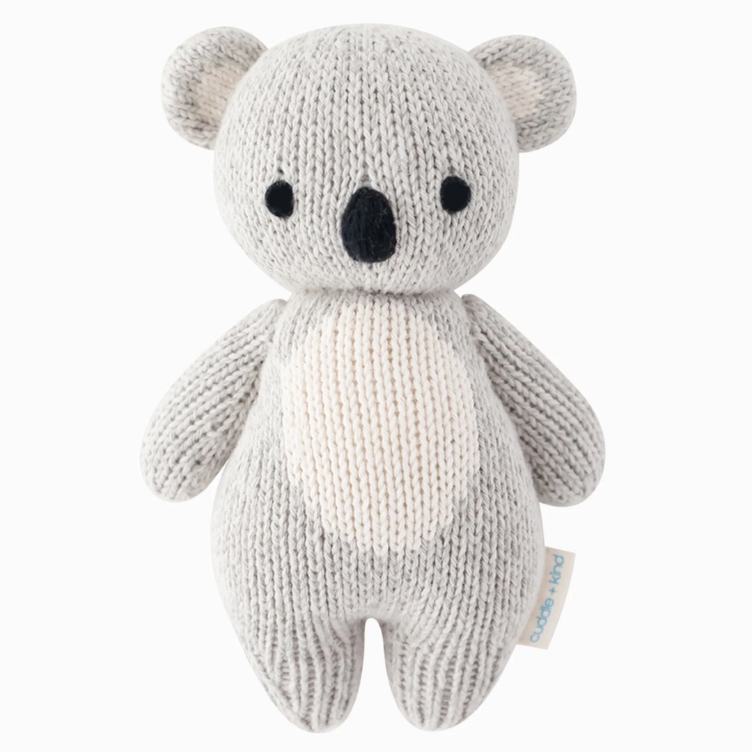 Baby Koala | A gray, white, and black knit baby koala plushie.