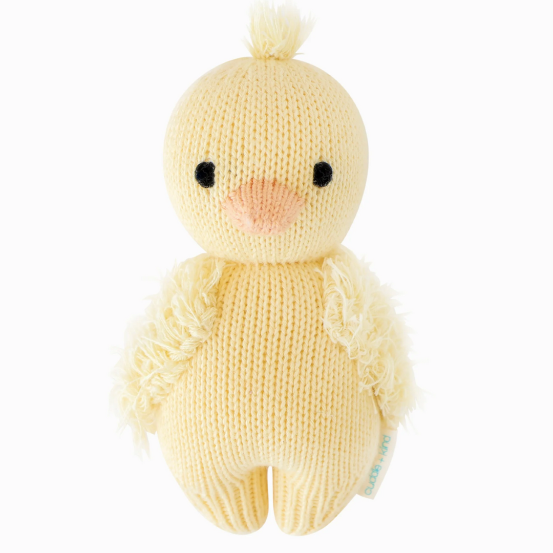 Baby Duckling | Cuddle + Kind | A yellow knit duckling with soft wings and an orange beak.