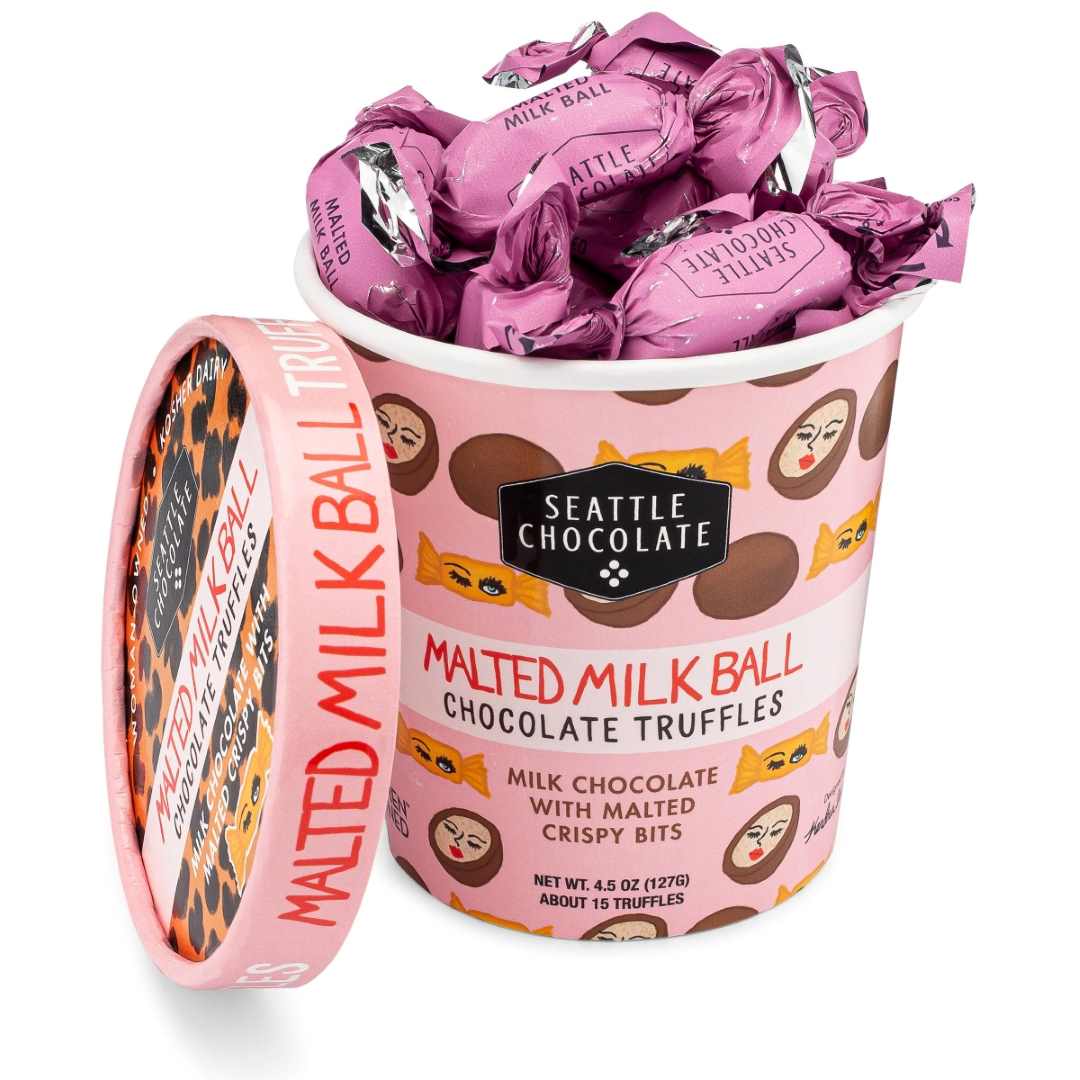 Seattle Chocolate | Malted Milk Ball Truffle Pint - 4.5oz | A pink ice cream pint container holding individually wrapped malked milk ball chocolate truffles.