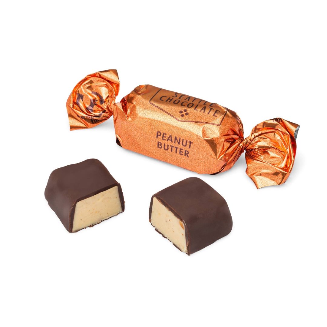 Seattle Chocolate | Peanut Butter Truffles - Singles | An individually wrapped chocolate truffle with a peanut butter interior. The wrapper is orange.