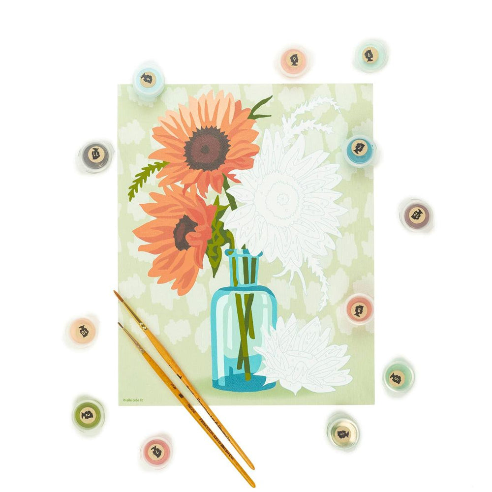 She Creates | Paint by numbers | Sunflowers | Painting shown partially painted with labeled paint cups and paint brushes.