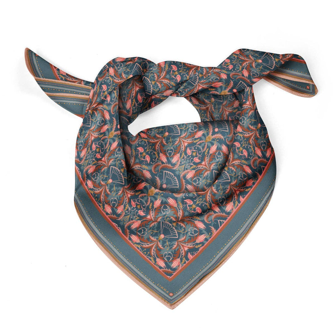 Patterned scarf with a blue and orange design on a white background