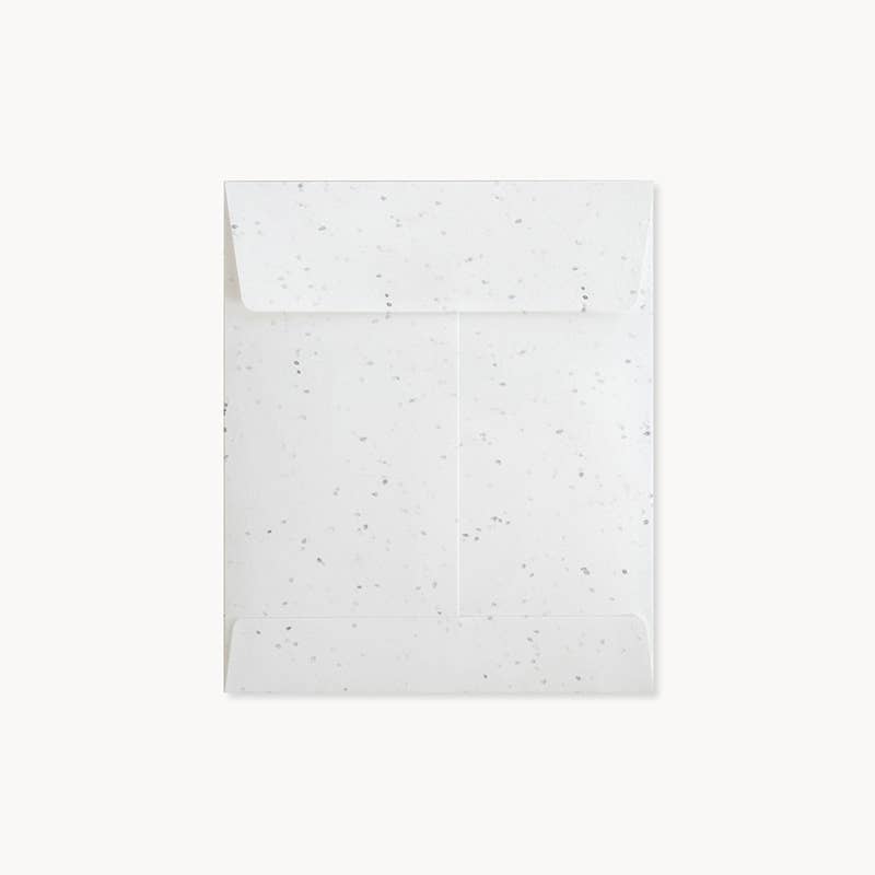 The envelope is white with gray specks.