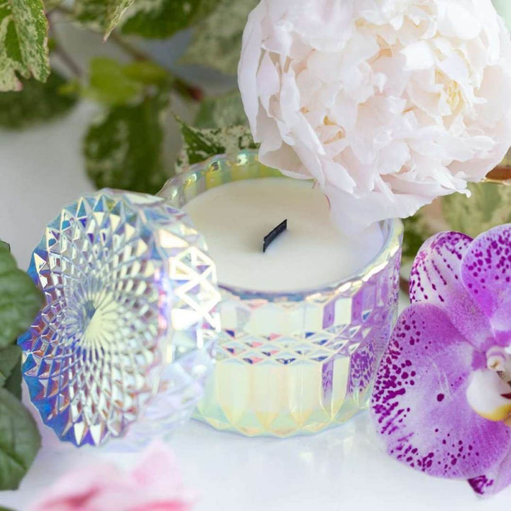 Iridescent etched candle holder with black wooden wick in Stacy k florals signature scent. 