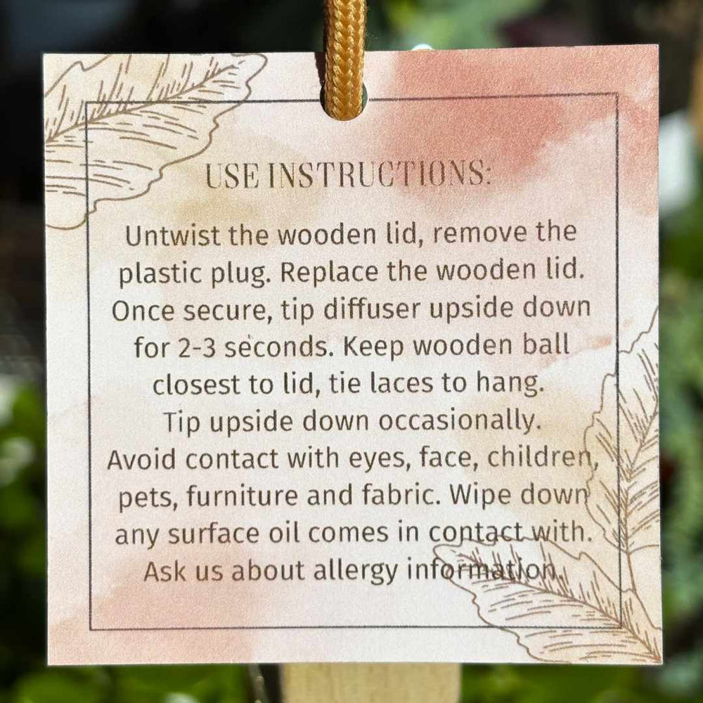 Stacy K Floral | Fleurish Co. | Fall Foliage | Instructions for using a wooden diffuser with decorative text and illustrations on a pink background.