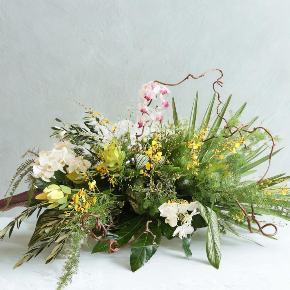Stacy K Floral | Natural Spray floral arrangement with greenery and orchids.