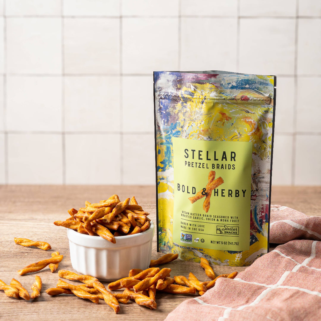Bag of Stellar Pretzel Breads with pretzels on a wooden surface and tiled wall background