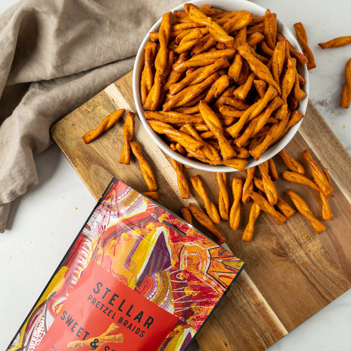Stellar pretzel snacks on a wooden board with packaging