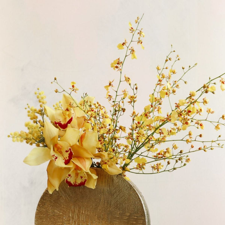 Sunlight | Stacy K Floral | Close up on the yellow orchids in this bright arrangement.