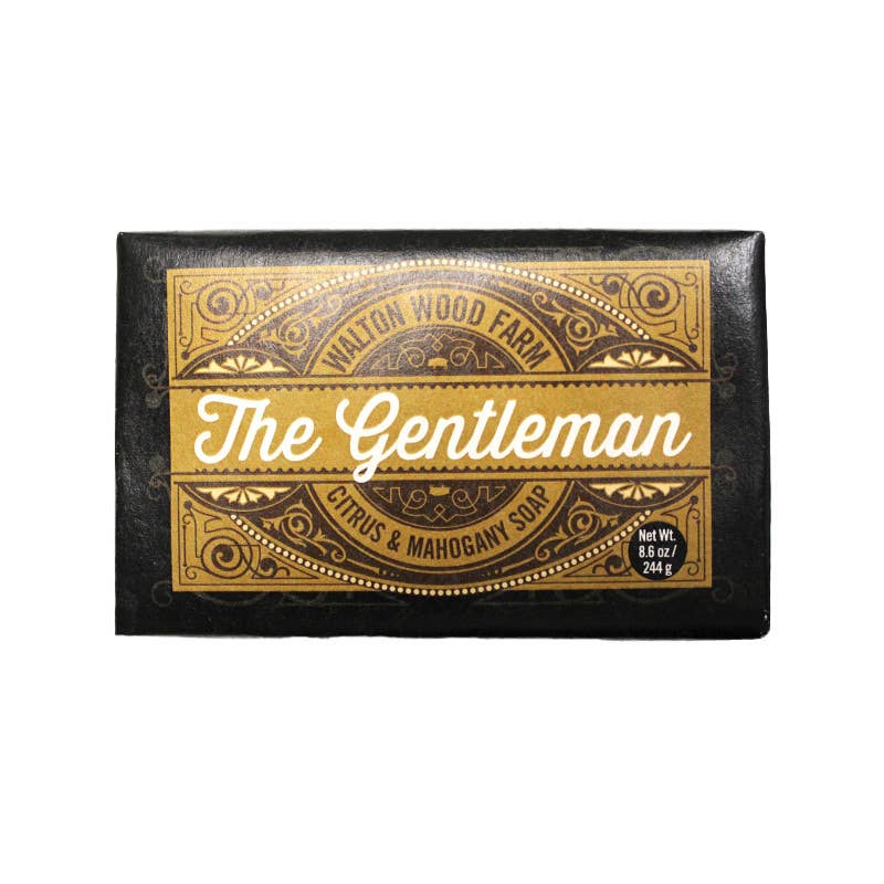Bar of soap with decorative packaging featuring &