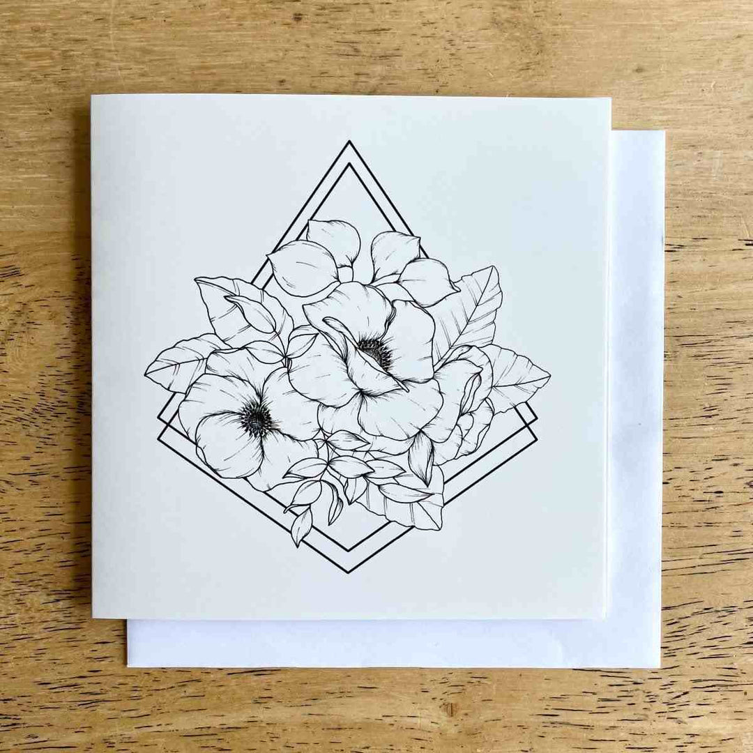 The House of Roushey | Greeting Card | A white card with a floral design.