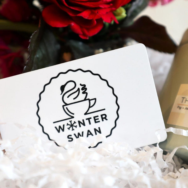 The Locals Gift Box | Close up on the black and white winter swan giftcard.