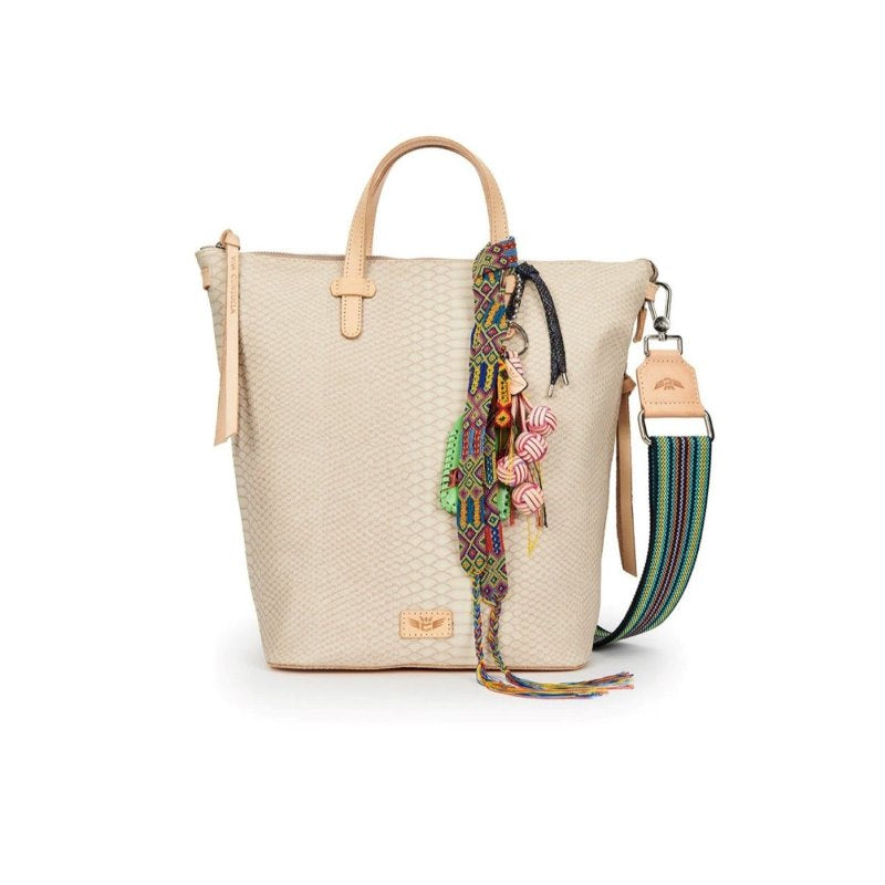 A beige leather bucket bag with an embossed snake print exterior, featuring a laptop compartment, a leather handle, and an adjustable woven crossbody strap.