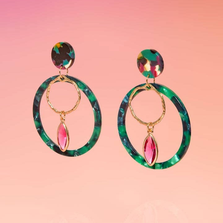 Tribe + Temple | Hoop Earrings with a dangling pink piece.