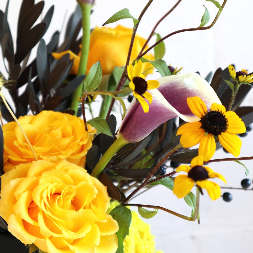 Vibrant | Close up on the roses and a calla lily.