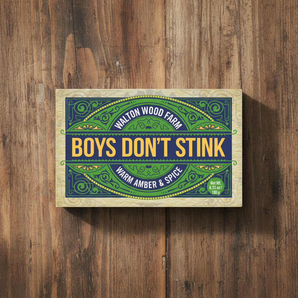 Soap bar with 'Boys Don't Stink' text and branding on a white background