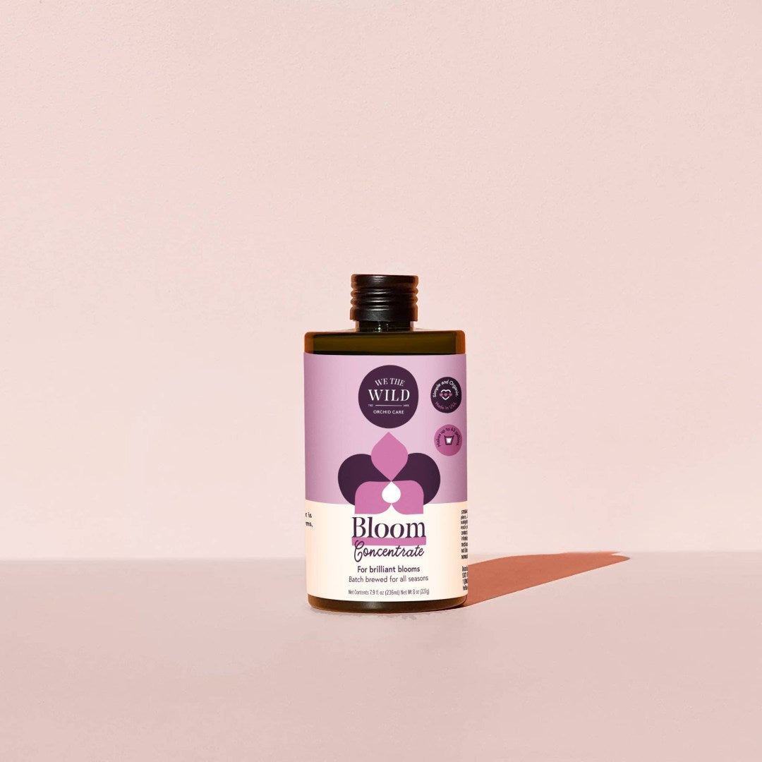 We The Wild | Bloom Concentrate | A light purple bottle with a minimalistic design.