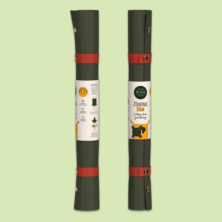 We The Wild | Two rolled-up potting mats with labels on a light green background