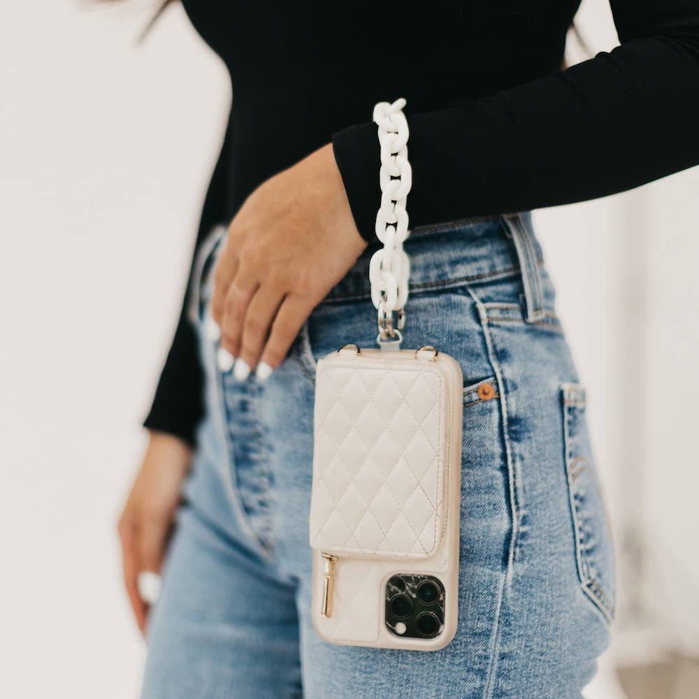 A white chain wristlet attached to a phone with soft leather quilted case.