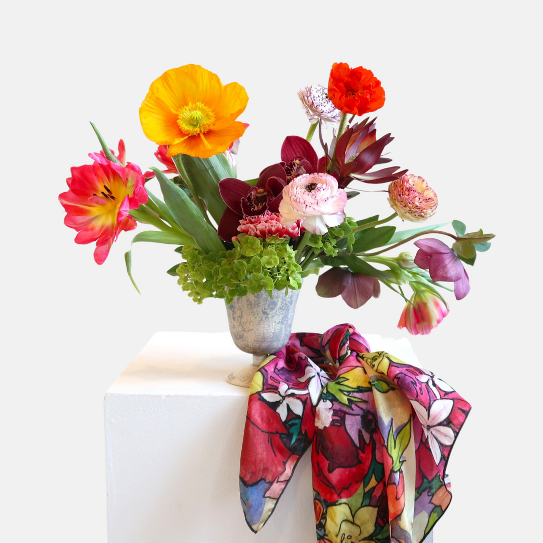 poppy, orchids, tulips. hydrangea, ranunculus pictured with a colorful silk scarf done by andrea durfee