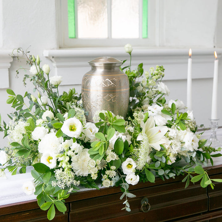 White and green sympathy flower garland for memorial urn