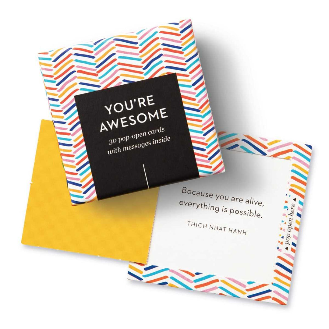 Compendium | You're Awesome | 30 pop-open cards with messages inside. Colorfully design box and cards. Sample message that reads "Because you are alive, everything is possible." Thich Nhat Hanh.