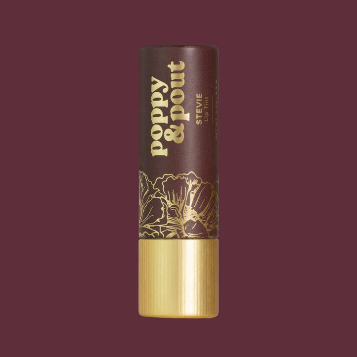 Poppy & Pout | Lip Tint, Stevie | A deep purple sleeve with gold accents.