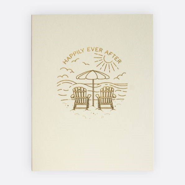 Beach Adventure Greeting Card | An off white greeting card with two chairs on the beach, titled "Happily Ever After".