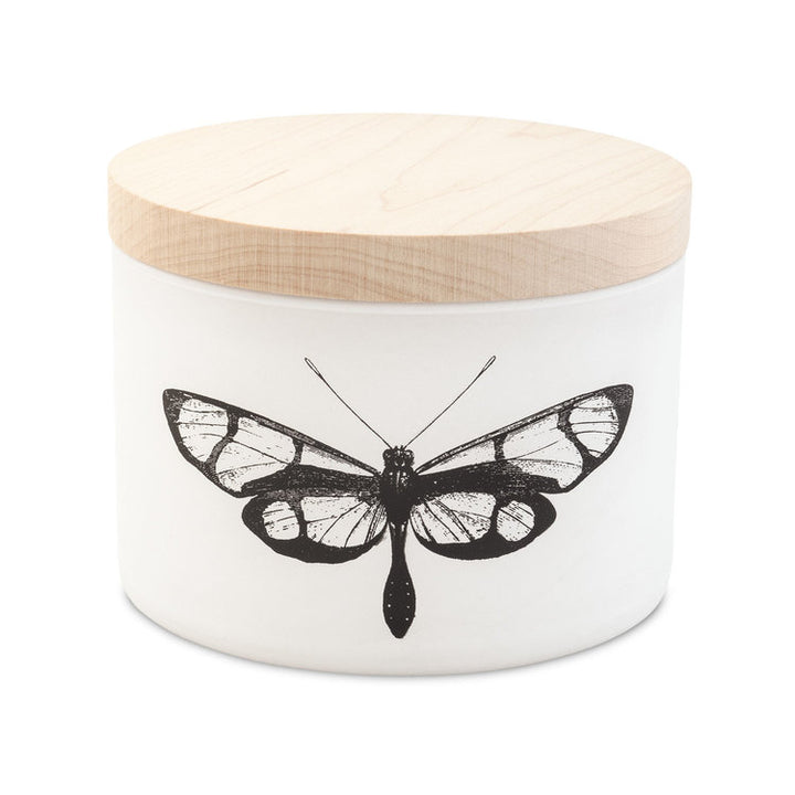 Skeem | Citronella Candle with a woodblock lid and butterfly illustration.