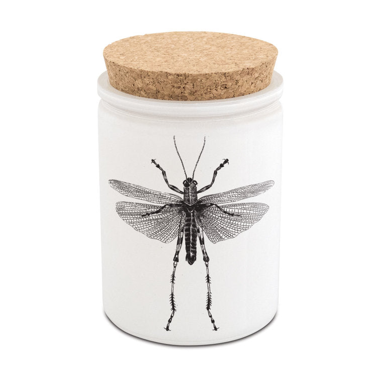 Skeem | Citronella candle with a cork lid and grasshopper illustration.
