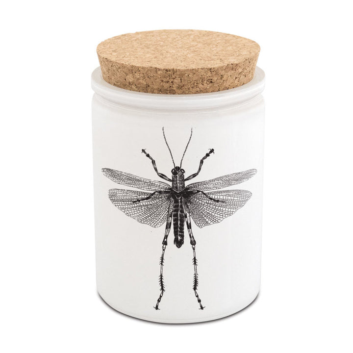 Skeem | Citronella candle with a cork lid and grasshopper illustration.