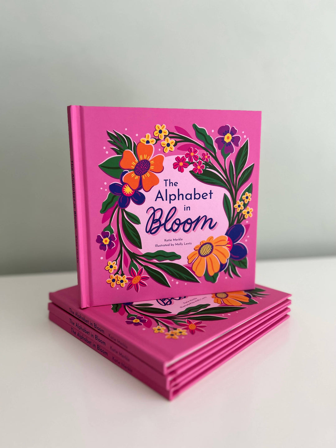 The Alphabet in Bloom is a 7x7 hardcover flower alphabet book with boldly illustrated design.