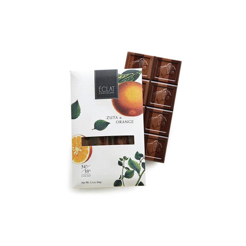 Chocolate bar with packaging featuring orange and leaf design on a white background