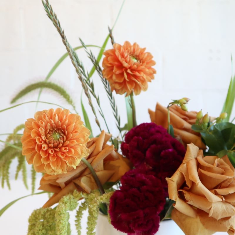 Thanksgiving centerpiece with carnations roses and dahlias