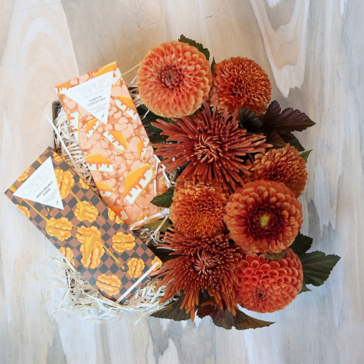 Fall Gift Box | Two Compartes chocolate bars with a fall colored floral arrangement. Full of deep orange colors with accent greens.