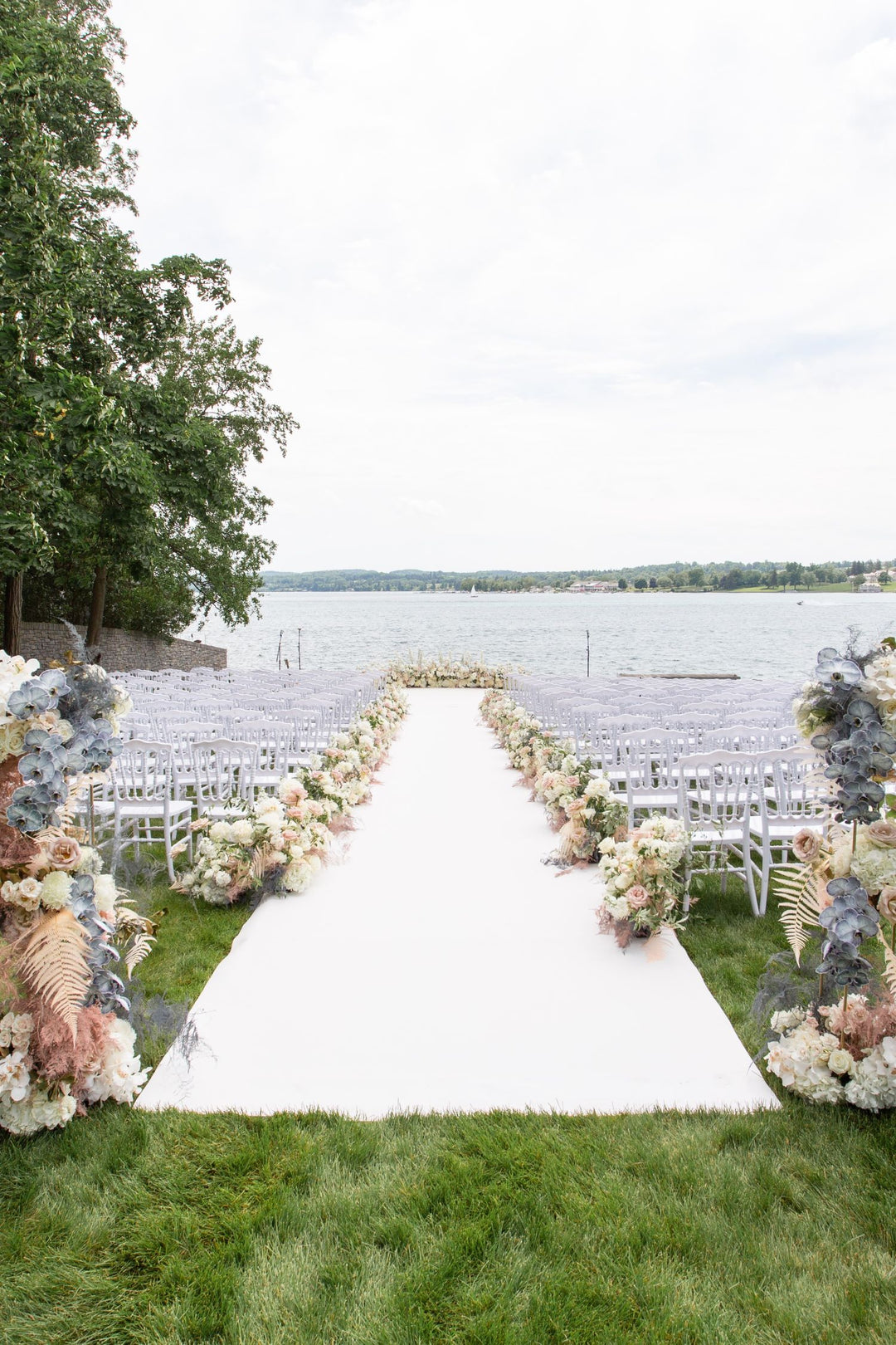 Floral lined aisle by the water
