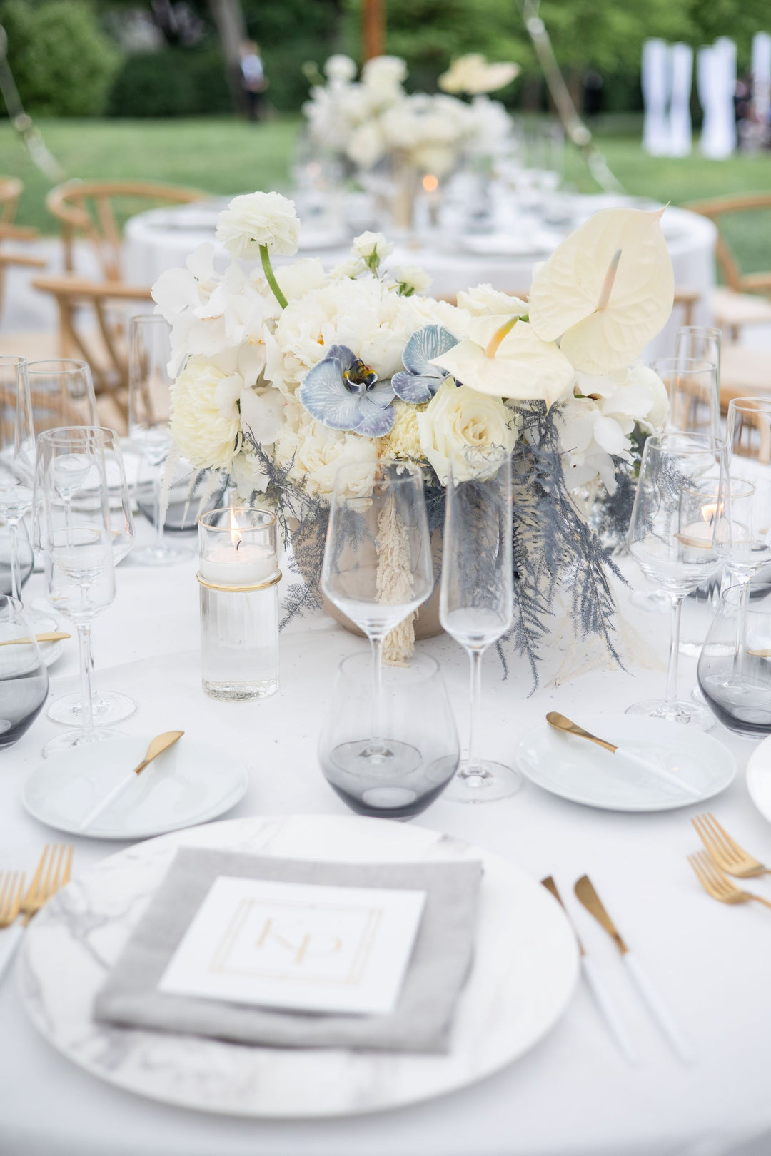white and grey centerpiece with grey orchids