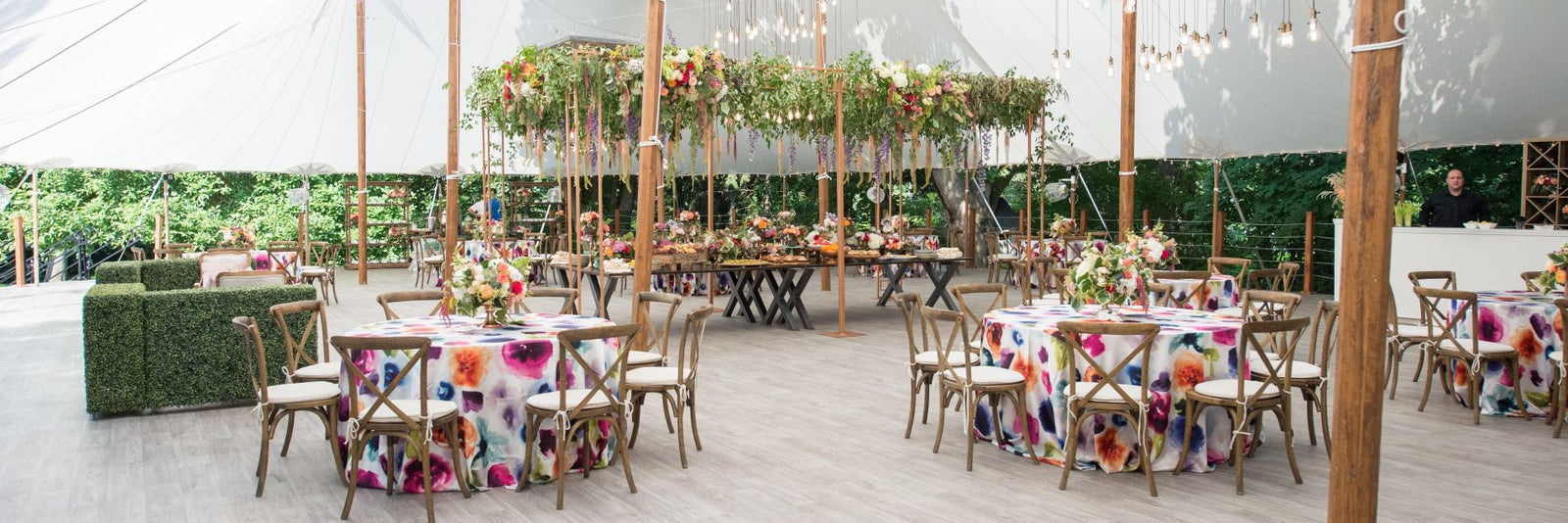dramatic and colorful tented wedding in Pittsford with hanging floral installation