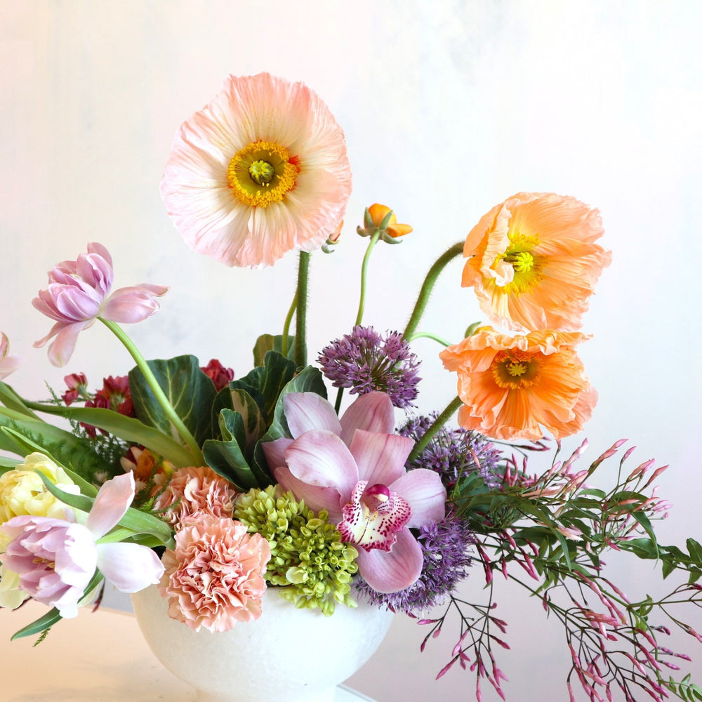 Ravishing | Close up on the bright flowers in the fresh floral arrangement.