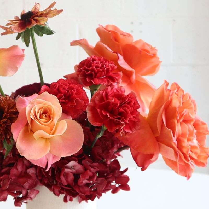 Fall arrangement of roses, hydrangea dahlias and mums
