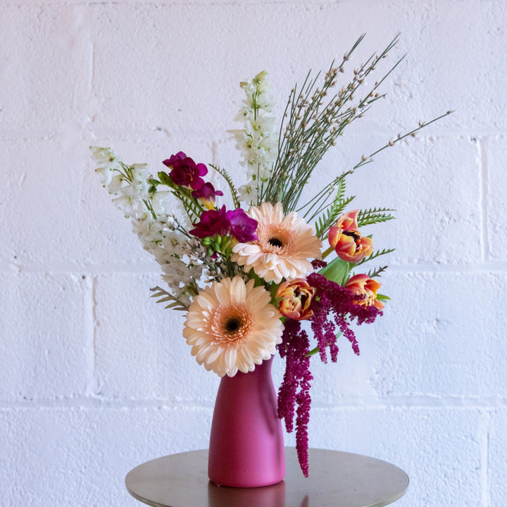 Floral arrangement in a pink vase