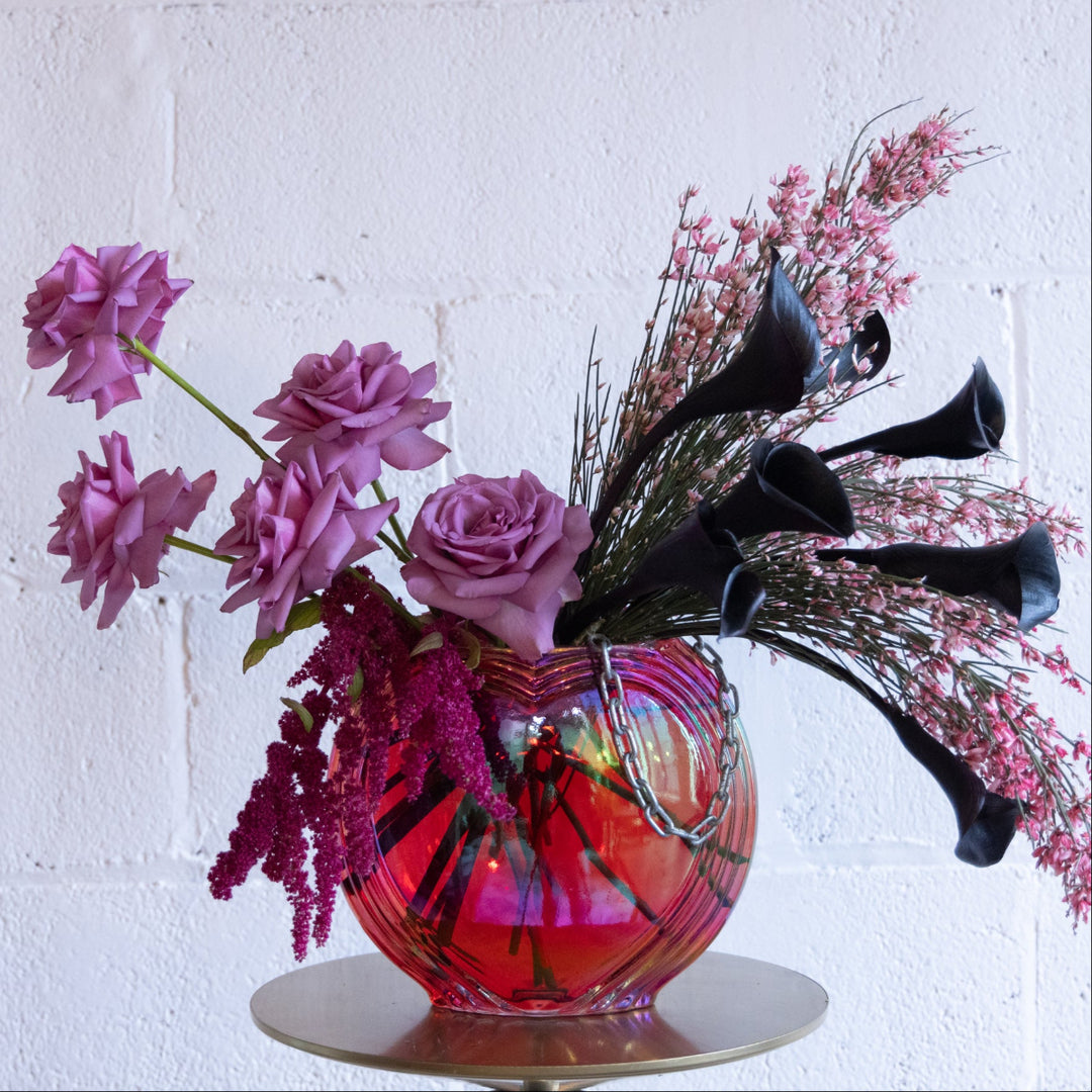 Decorative vase with pink and black flowers