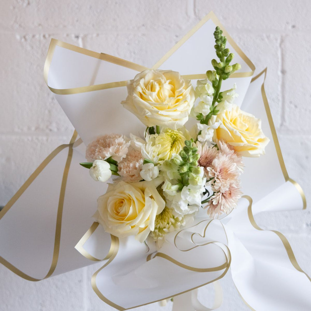Bouquet of flowers with yellow and white roses on a white background